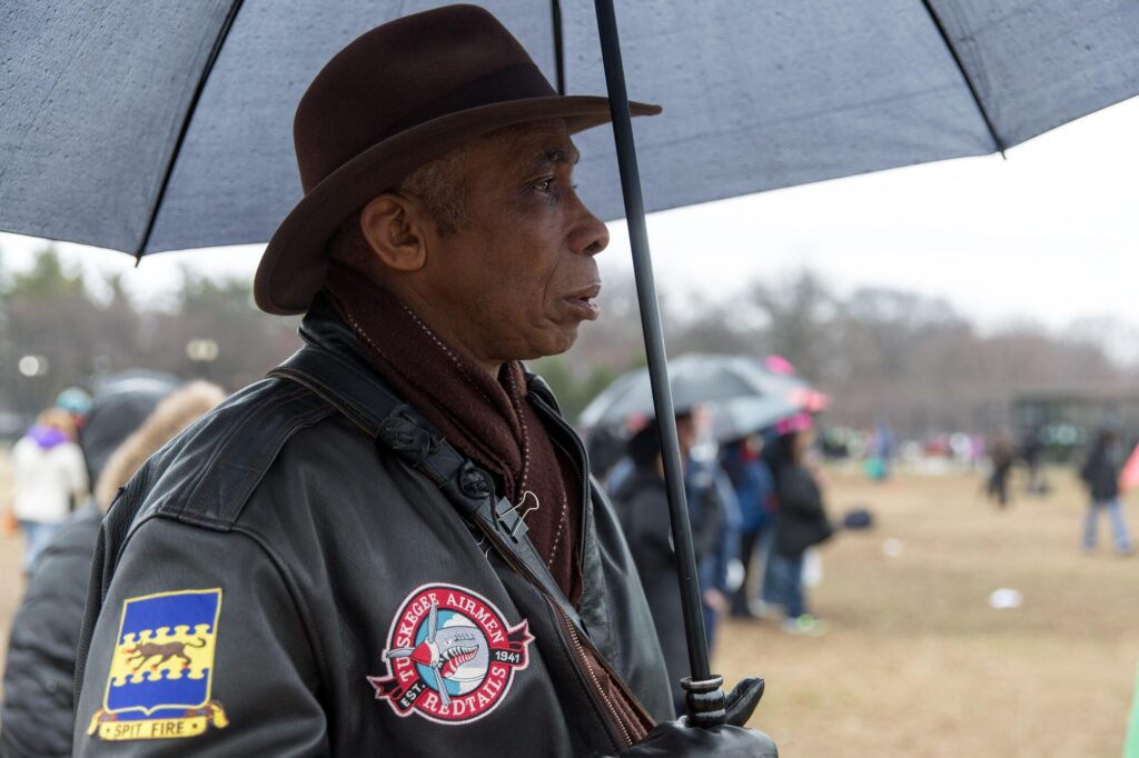 By Lorie Shaull from St Paul, United States - A member of the Tuskegee Airmen, 332nd Fighter Group, We Shall Not Be Moved Rally, Washington DC, CC BY-SA 2.0 | Madison Ave Magazine