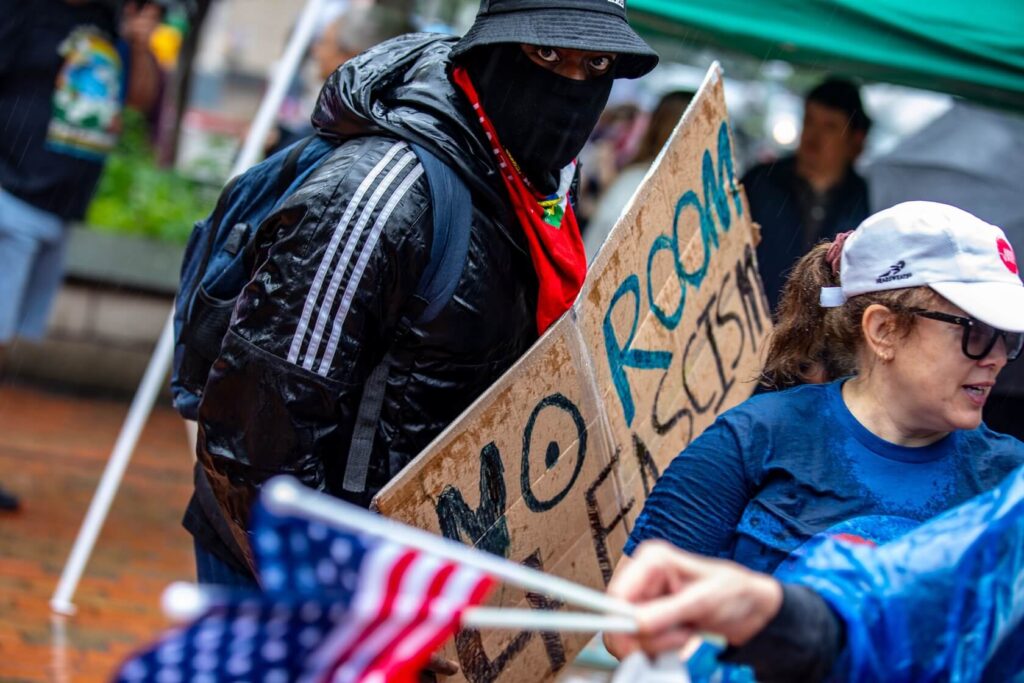 Protestor moves with a sign
